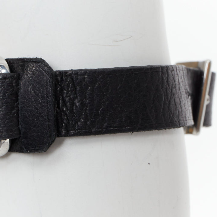 LOUIS VUITTON Champs Elysee black leather floral motif LV metal plate bracelet