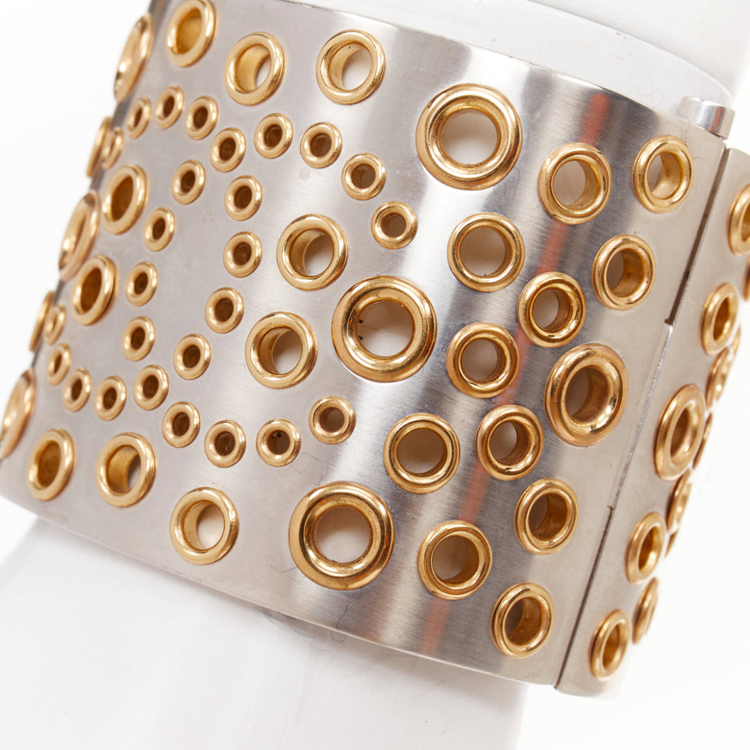 CHANEL B16 silver tone gold CC logo punctured grommet eyelet cuff bangle