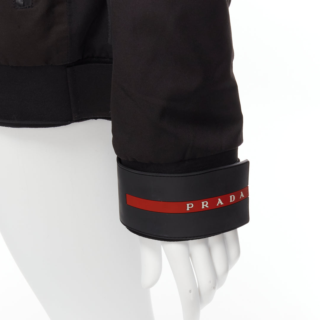 Female mannequin wearing Prada by Miuccia Prada 2021 Linea Rossa Black Nylon Women Parka Jacket in Size  M | Available at JHROP