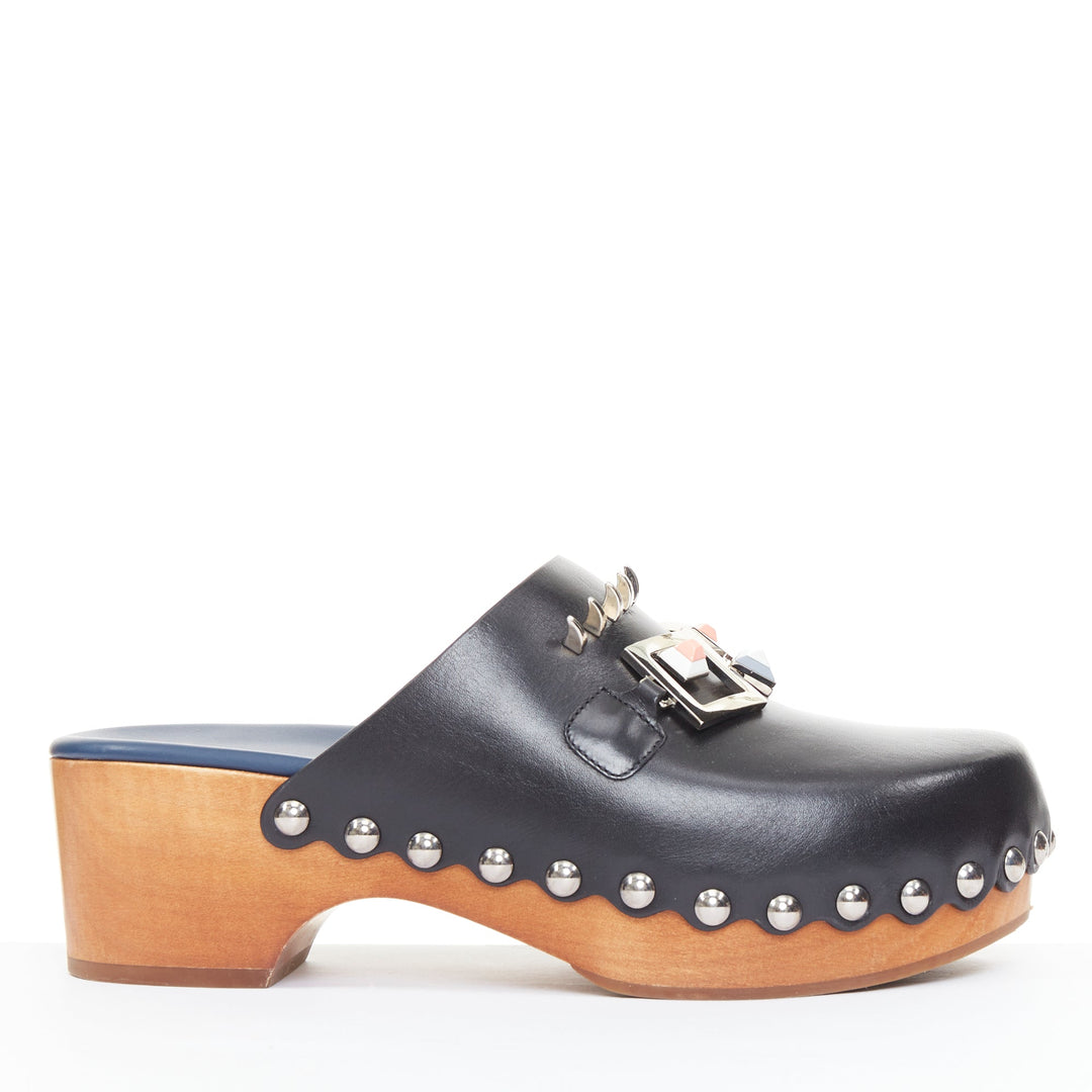 FENDI Hypnoteyes Monster Bag Bug black stud embellished wooden clog mules EU40