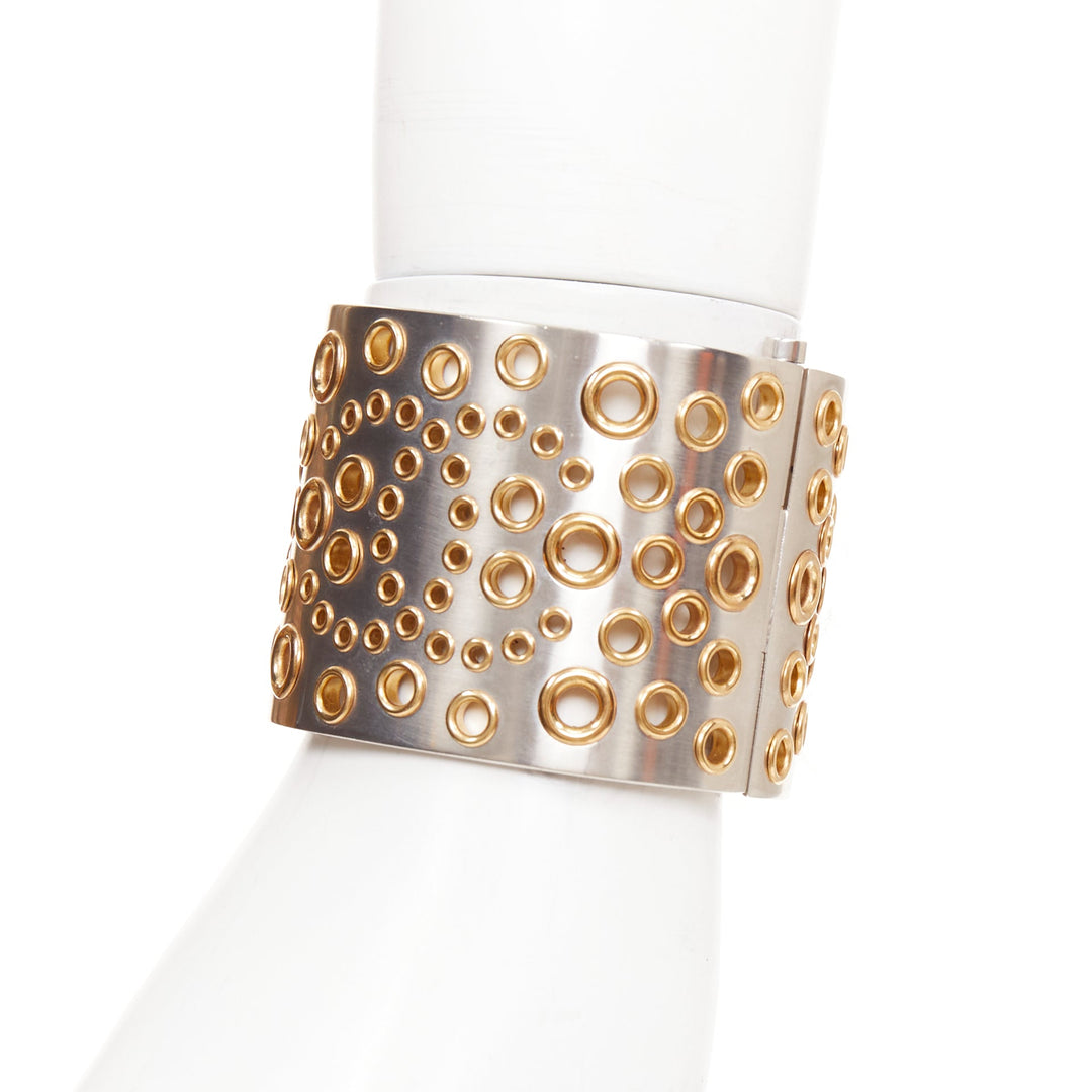 CHANEL B16 silver tone gold CC logo punctured grommet eyelet cuff bangle