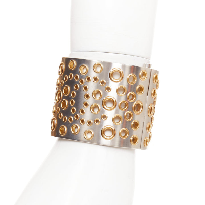 CHANEL B16 silver tone gold CC logo punctured grommet eyelet cuff bangle