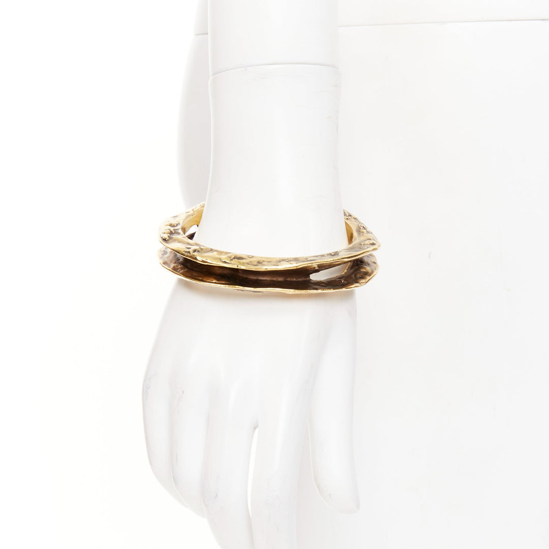 SAINT LAURENT 2023 Tornato Crater antique gold tone hammered hollow cuff bangle