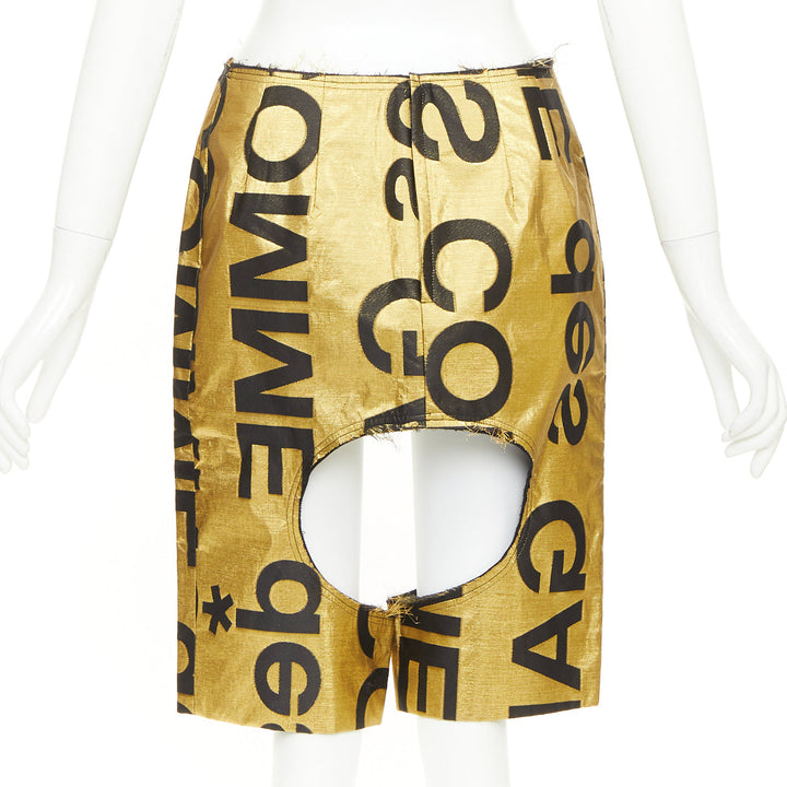 COMME DES GARCONS 2020 Runway gold black polyester silk logo cut out shorts M