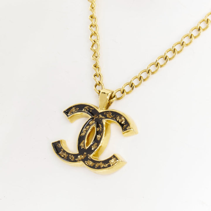 CHANEL 2023 Monte Carlo gold black glitter foil resin CC logo pendant  necklace