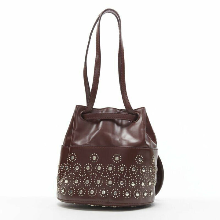 ALAIA burgundy red geometric silver studded drawstring mirror charm bucket bag