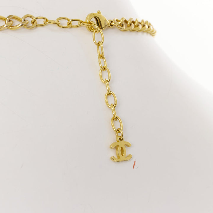 CHANEL 2023 Monte Carlo gold black glitter foil resin CC logo pendant  necklace