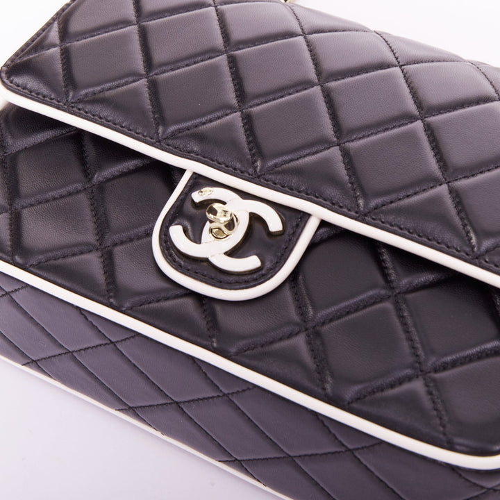 CHANEL 2025 Graphic Frame black quilted lambskin piping mini square flap bag