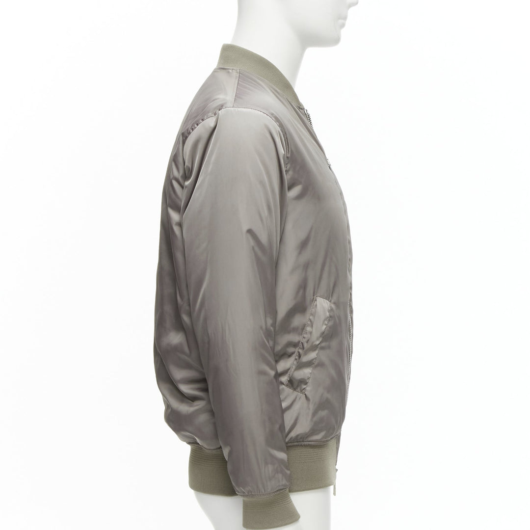 Male mannequin wearing Kith Grey Polyester Men Bomber Jacket in Size  M | Available at JHROP