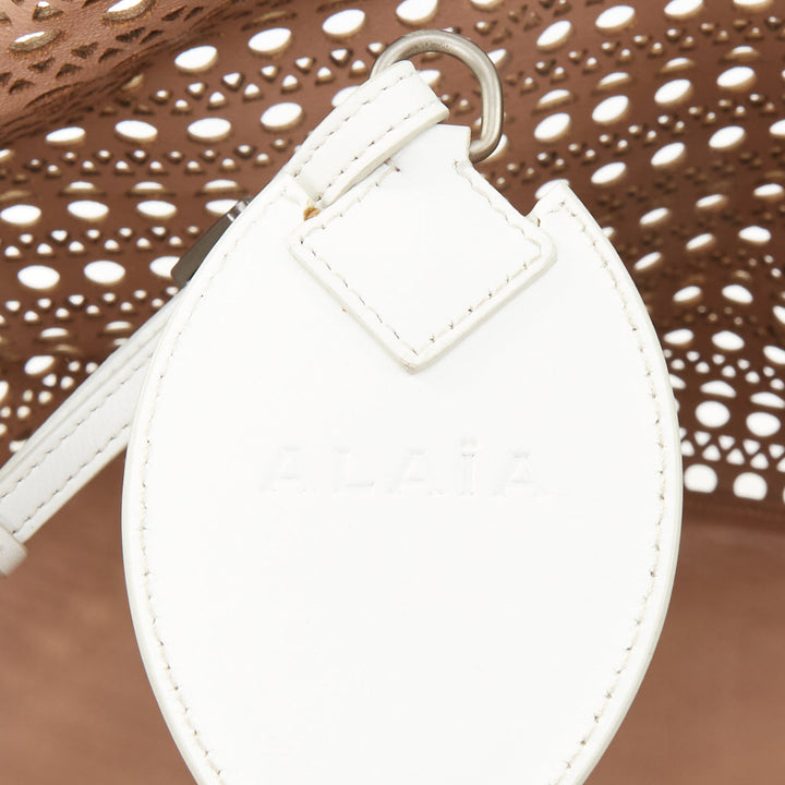 ALAIA Le Mina Vienne Wave laser cut white calfskin leather travel tote bag
