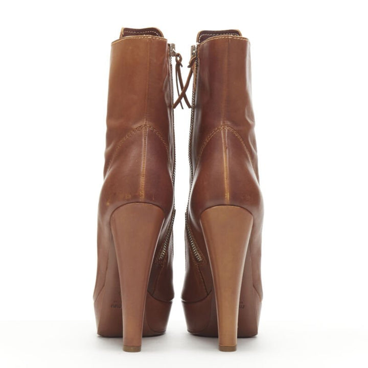 Female mannequin wearing Miu Miu by Miuccia Prada Peep toe bootie Brown Leather Women Heels in Size EU37.5 | Available at JHROP