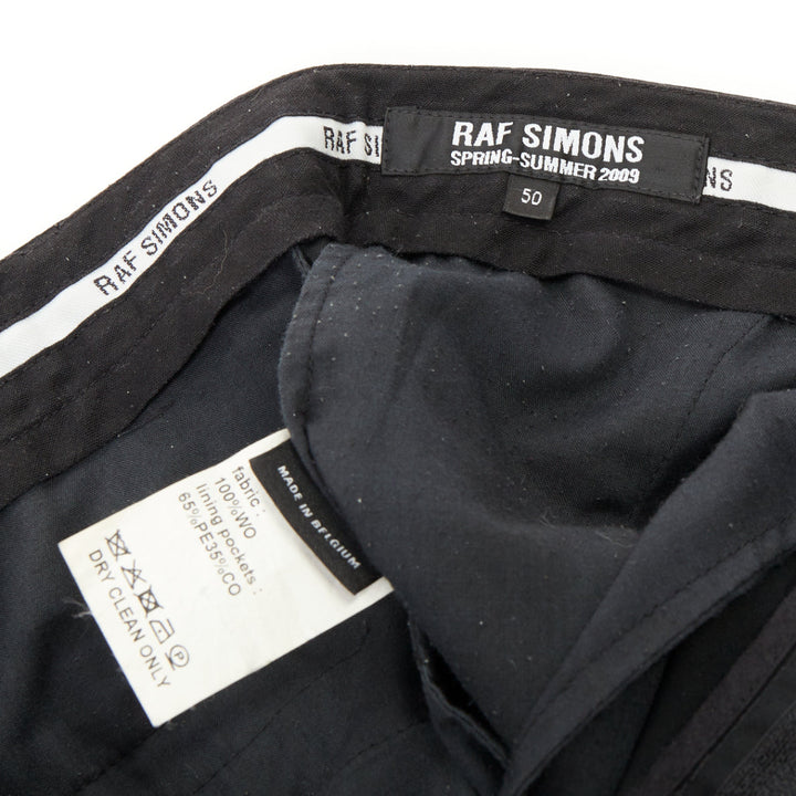 RAF SIMONS 2009 black wool mid rise tailored turn up trouser shorts EU50 L