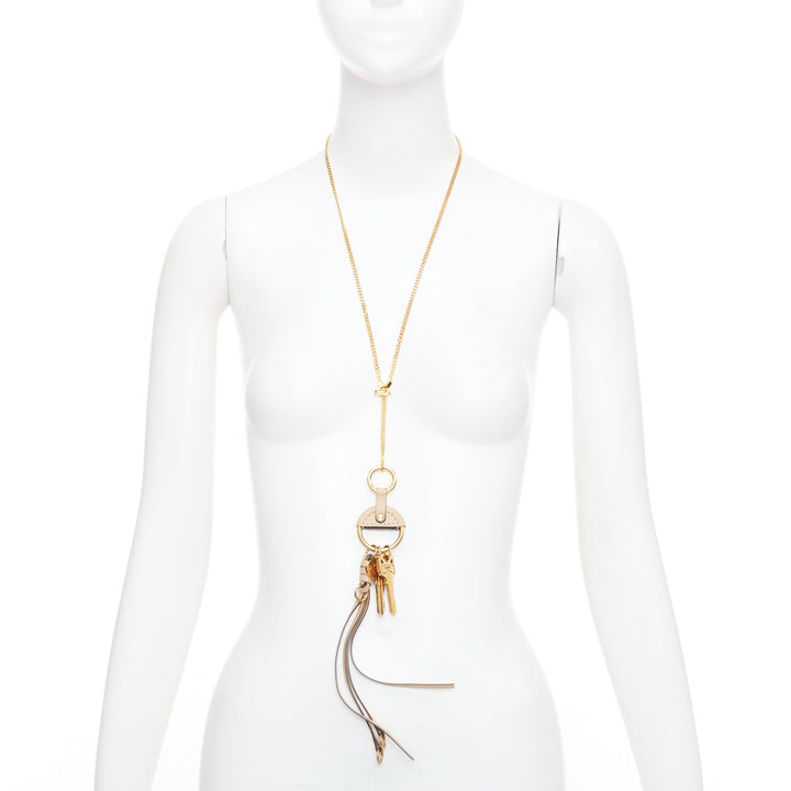 CHLOE Nicole brown leather gold Happy key chain bag charm long necklace