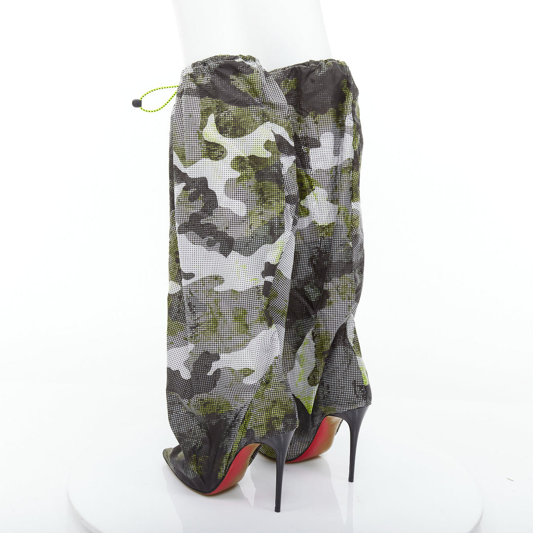 Female mannequin wearing Christian Louboutin Wind Botta 100 Green Nylon Women Boots in Size EU38 | Available at JHROP