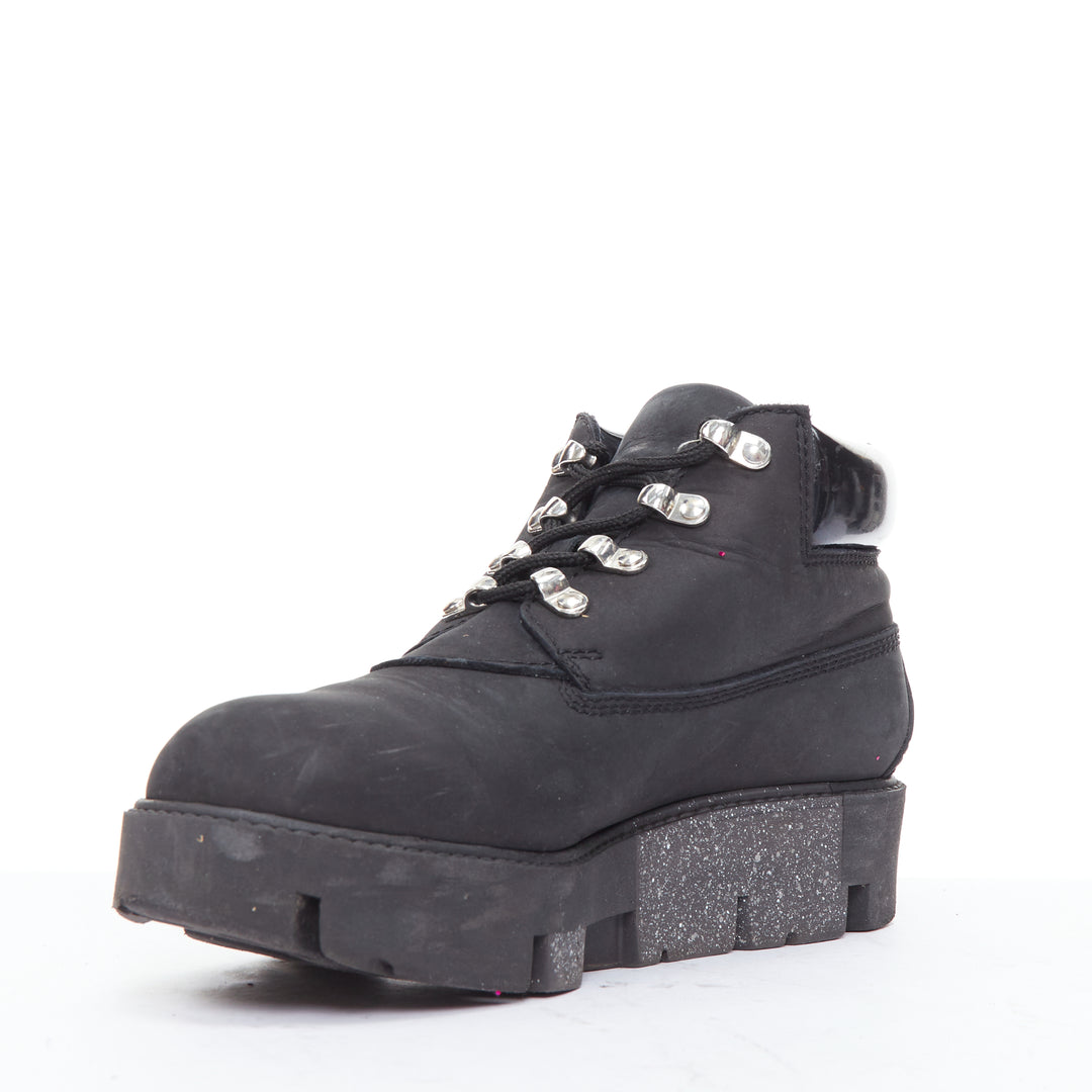 Female mannequin wearing Acne Studios Tinnie Black Leather Women Boots in Size EU38 | Available at JHROP