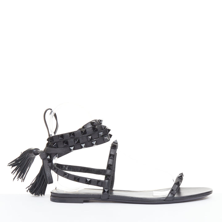 VALENTINO Rockstud black leather wraparound lace up tassel gladiator flats EU38