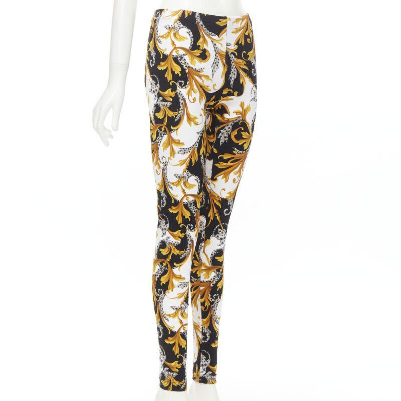 Female mannequin wearing Versace by Donatella Versace Barocco Acanthus Gold Polyamide Women Pants in Size IT42 | Available at JHROP