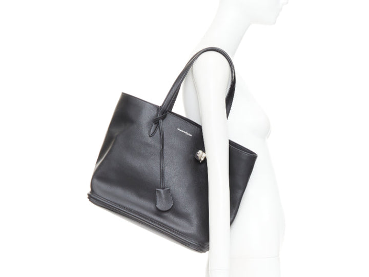 ALEXANDER MCQUEEN black calfskin leather silver skull lock tote bag