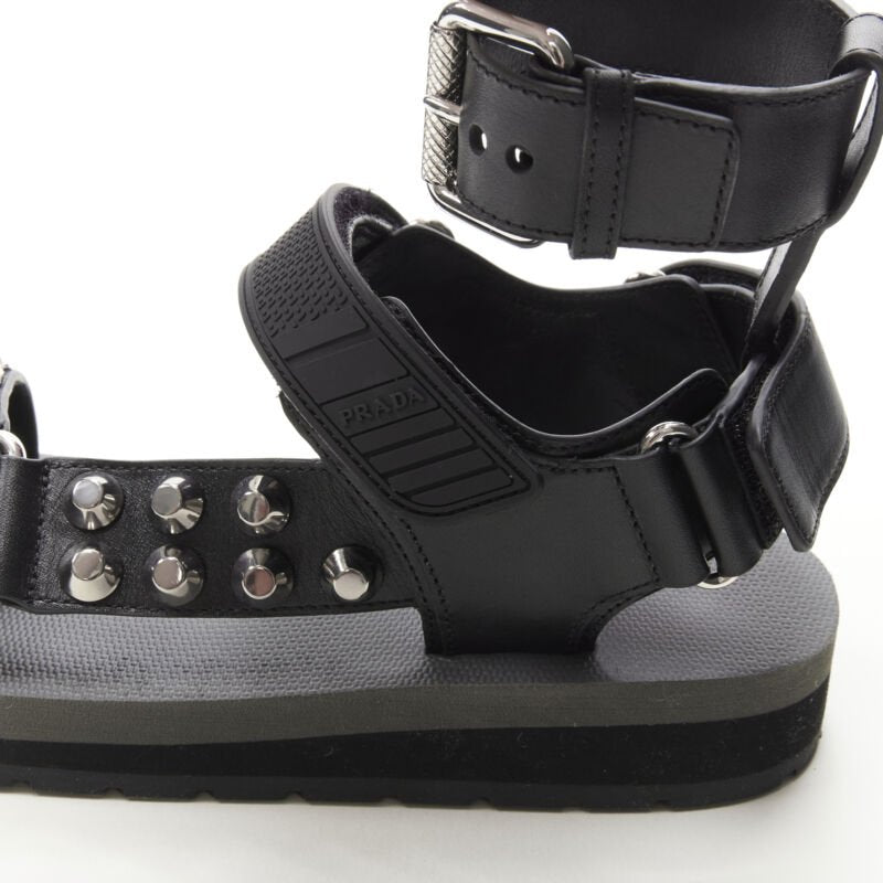 Female mannequin wearing Prada by Miuccia Prada Black Leather Women Sandals in Size EU36 | Available at JHROP