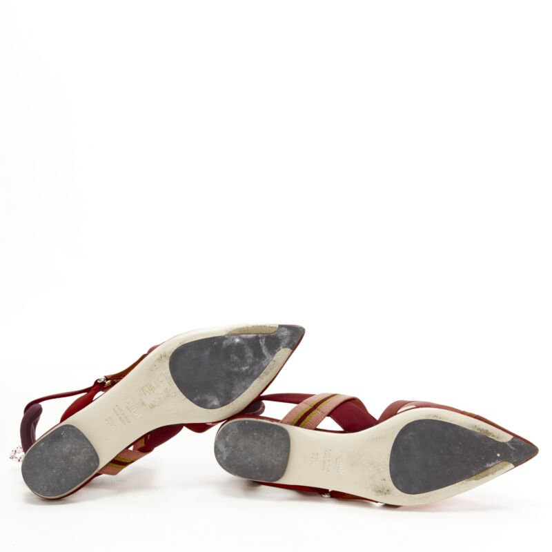 Female mannequin wearing Fendi Colibri Red Fabric Women Flats in Size EU36.5 | Available at JHROP