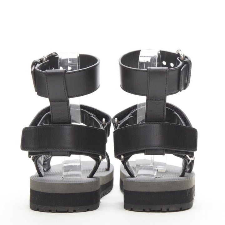 Female mannequin wearing Prada by Miuccia Prada Black Leather Women Sandals in Size EU36 | Available at JHROP