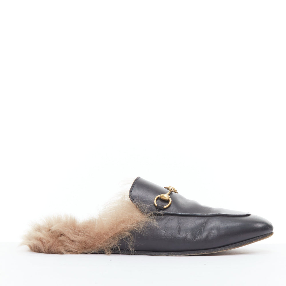 Female mannequin wearing Gucci by Alessandro Michele Princetown Black Leather Women Flats in Size EU38 - Size Label on sole is scuffed, for reference only | Available at JHROP