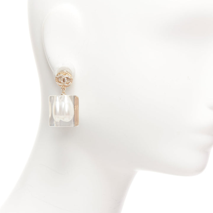 Female mannequin wearing Chanel by Karl Lagerfeld A19K White Faux Pearl Women Jewelry Earring in Size  | Available at JHROP