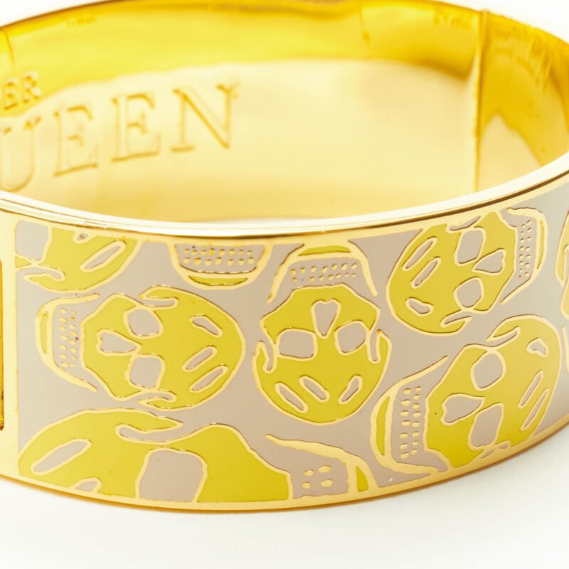 ALEXANDER MCQUEEN beige yellow skull enamel gold tone brass bangle cuff