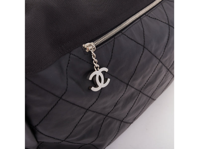 CHANEL XL Paris-Biarritz black coated canvas silver CC crossbody travel hobo bag