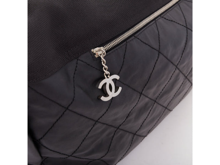 CHANEL XL Paris-Biarritz black coated canvas silver CC crossbody travel hobo bag