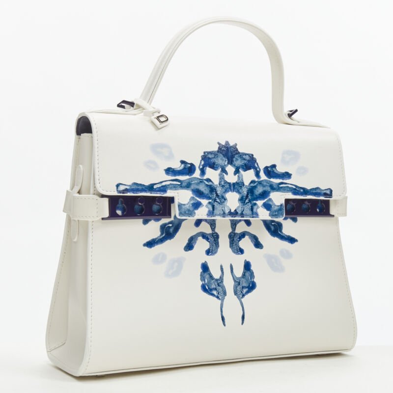 Female mannequin wearing Delvaux Tempete MM Papillon White Calfskin Leather Women Bag in Size  | Available at JHROP