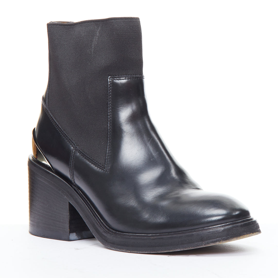 Female mannequin wearing Acne Studios Dion Black Leather Women Boots in Size EU38 | Available at JHROP