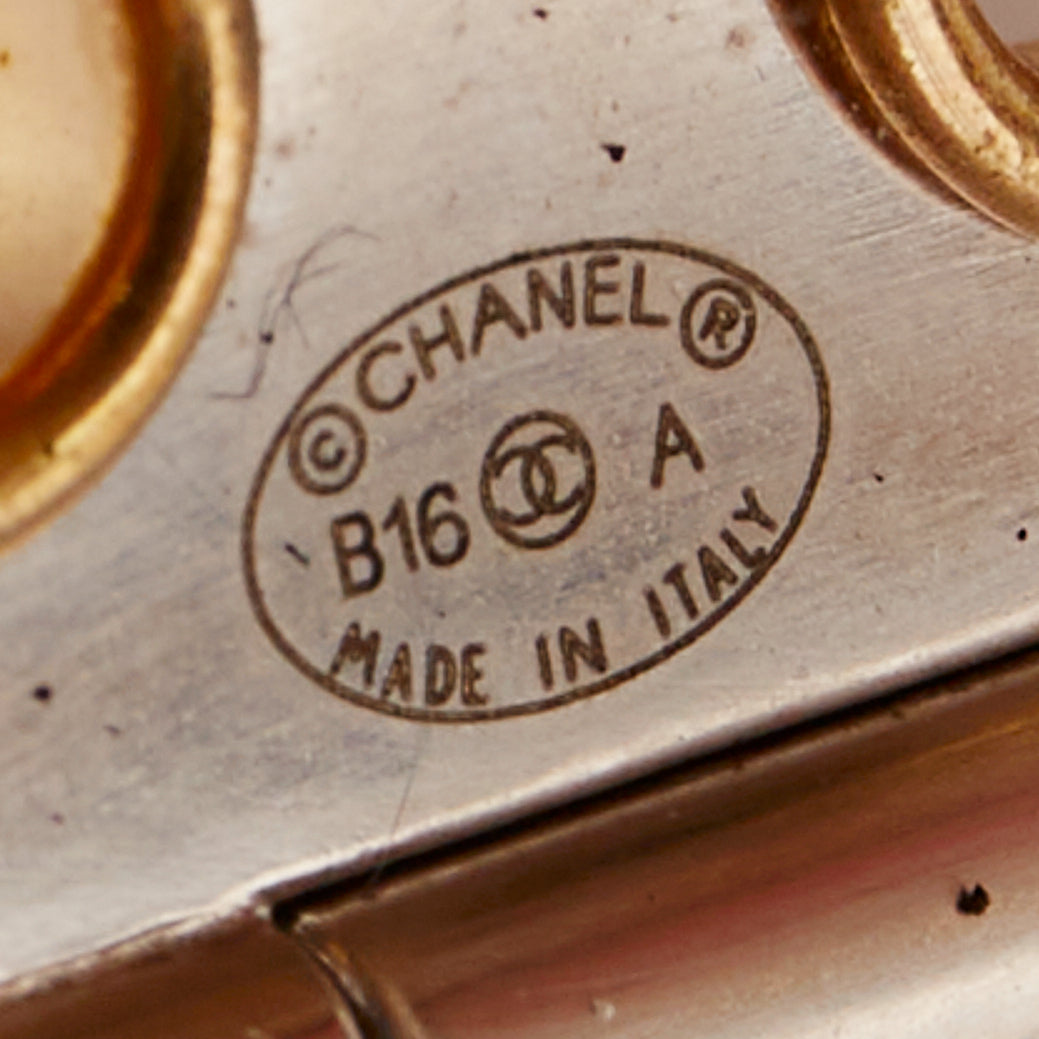 CHANEL B16 silver tone gold CC logo punctured grommet eyelet cuff bangle