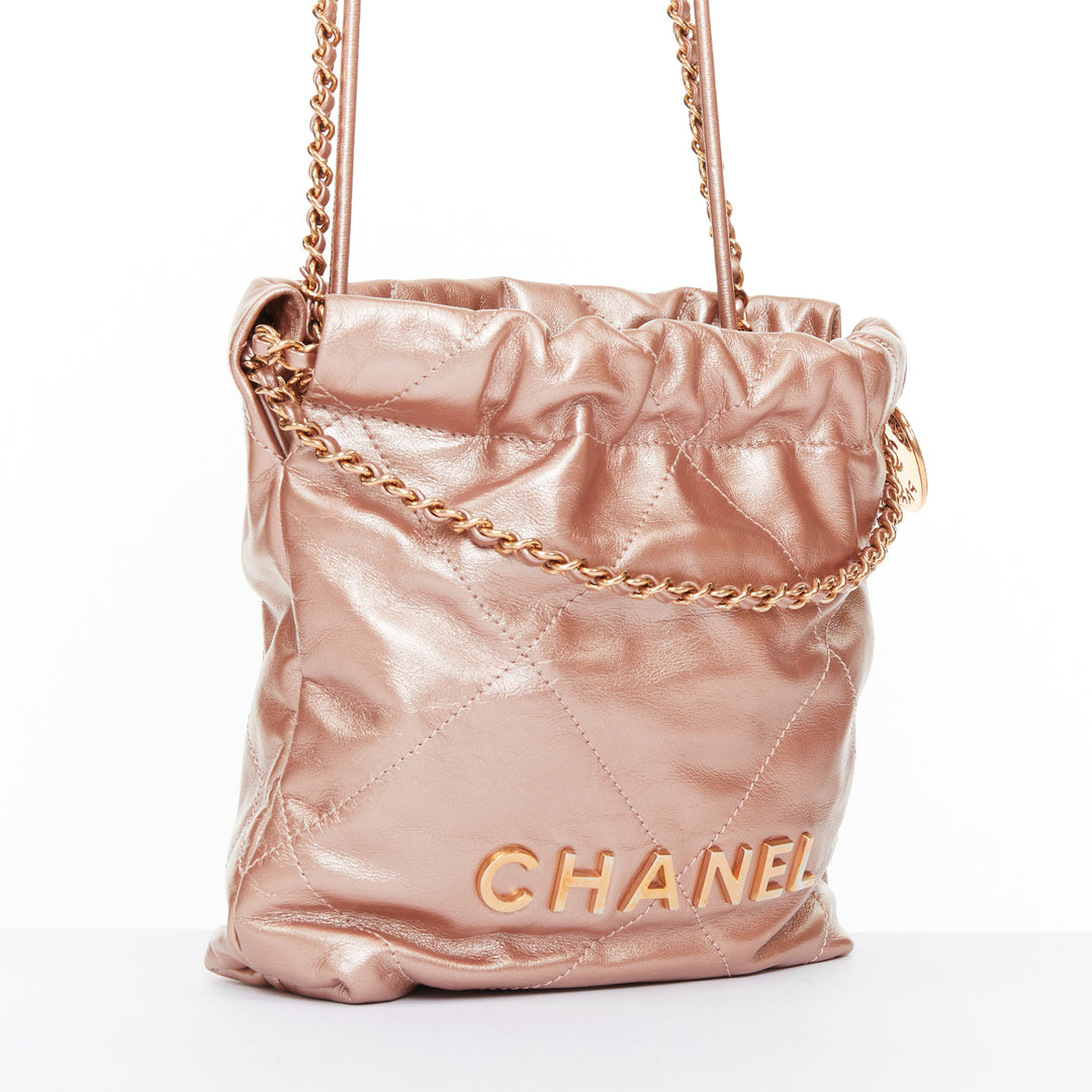 CHANEL 2023 Runway 22 Mini rose gold metallic calfskin leather drawstring bag