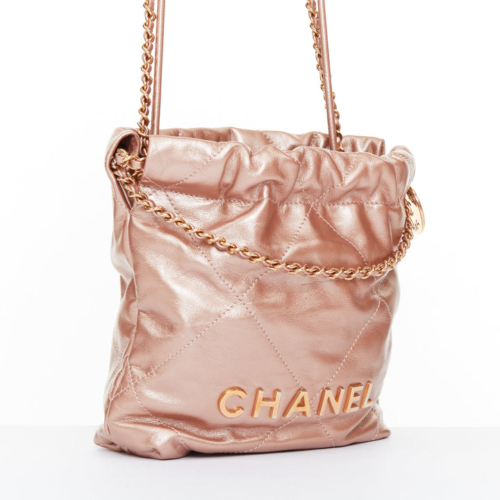 CHANEL 2023 Runway 22 Mini rose gold metallic calfskin leather drawstring bag