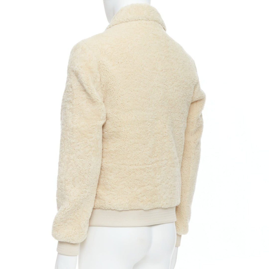 Male mannequin wearing A.P.C. Louis W Collection Cream Shearling Men Coat in Size  S | Available at JHROP