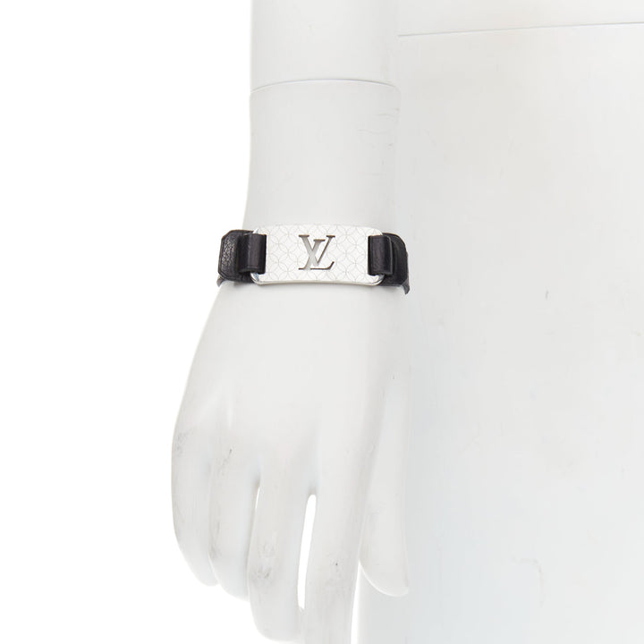 LOUIS VUITTON Champs Elysee black leather floral motif LV metal plate bracelet
