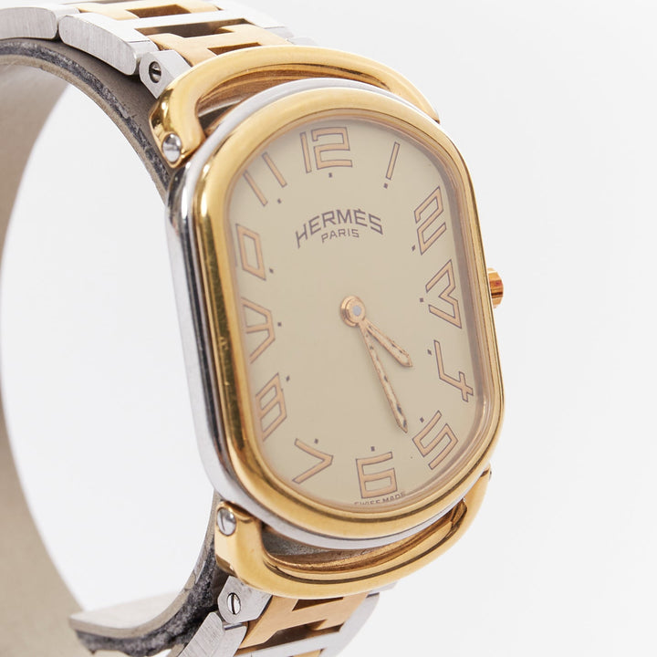 HERMES Rallye two-tone stainless steel gold plated saddle oval quartz watch