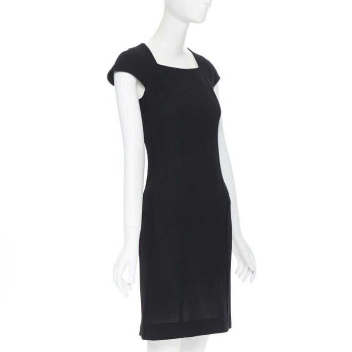 Female mannequin wearing Yves Saint Laurent by Stefano Pilati Sheath dress Black Wool Women Cocktail Dresses in Size FR36 | Available at JHROP