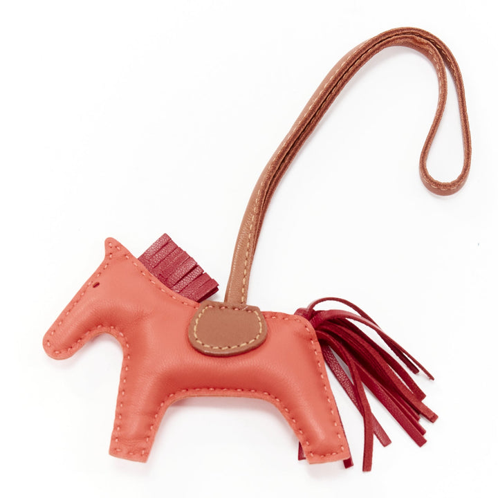 HERMES Rodeo PM red leather brown trim fringed tail horse bag charm