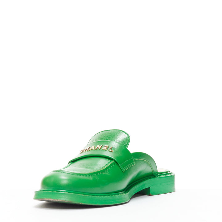 rare CHANEL PHARRELL green leather logo embellished slip on loafer flats EU37.5