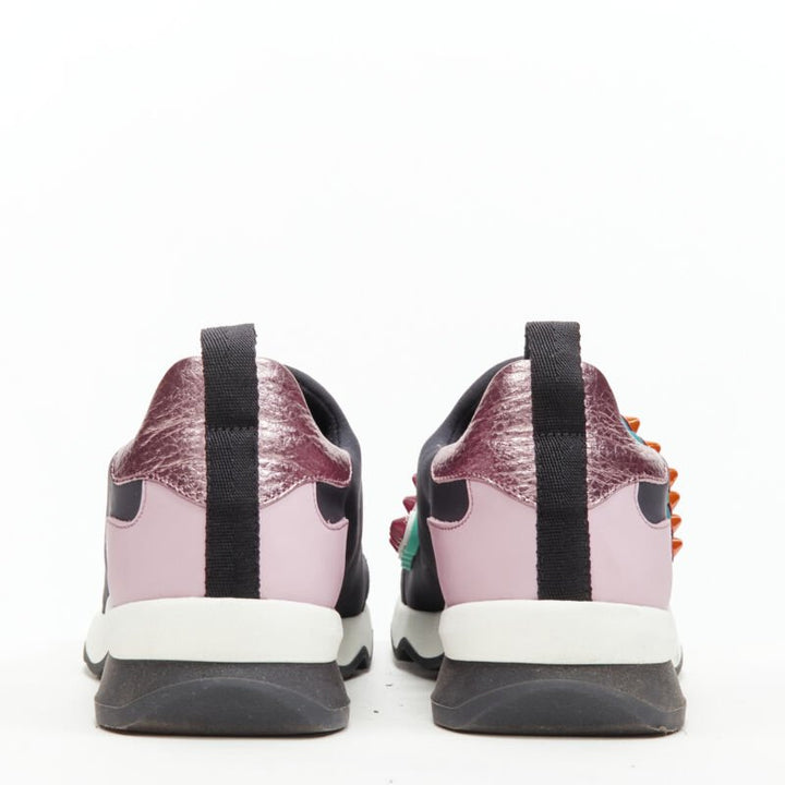 Female mannequin wearing Fendi Fun Fair Black Neoprene Women Sneakers in Size EU36 | Available at JHROP