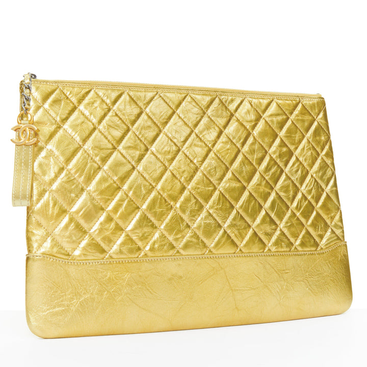CHANEL Gabrielle O-Case Large gold aged calfskin CC logo quilted clutch bag