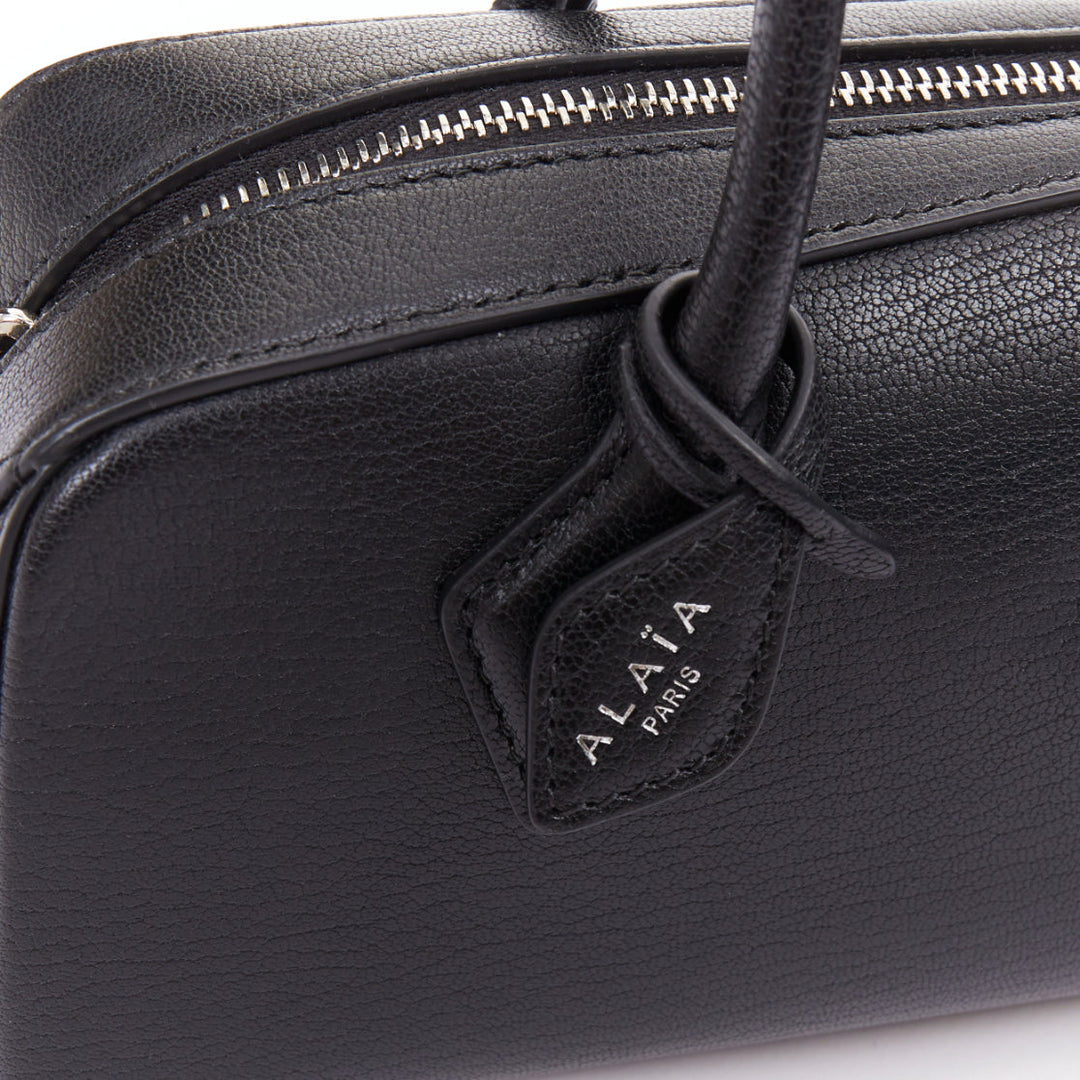 ALAIA Le Teckel black leather elongated long handle double zip bag