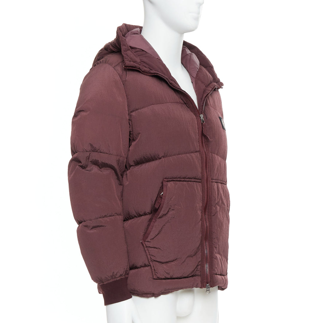 Male mannequin wearing Stone Island Purple Nylon Men Puffer Jacket in Size  M | Available at JHROP