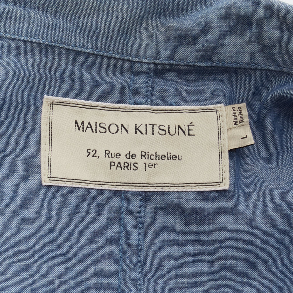 Male mannequin wearing Maison Kitsune Blue Feels like cotton Men Coat in Size  L | Available at JHROP