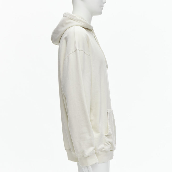 Male mannequin wearing Balenciaga by Demna 2021 Ecru Cotton Men Hoodies in Size  L | Available at JHROP