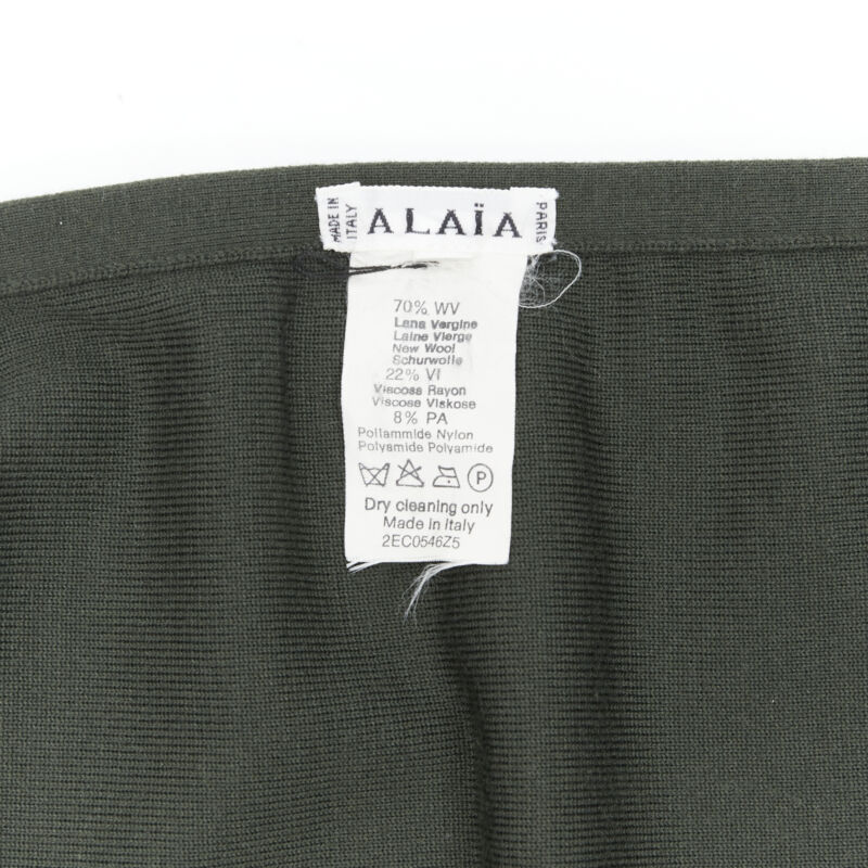 Female mannequin wearing Alaia by Azzedine Alaia Pleated flared wrap skirt Green Wool Women Skirt in Size FR40 | Available at JHROP