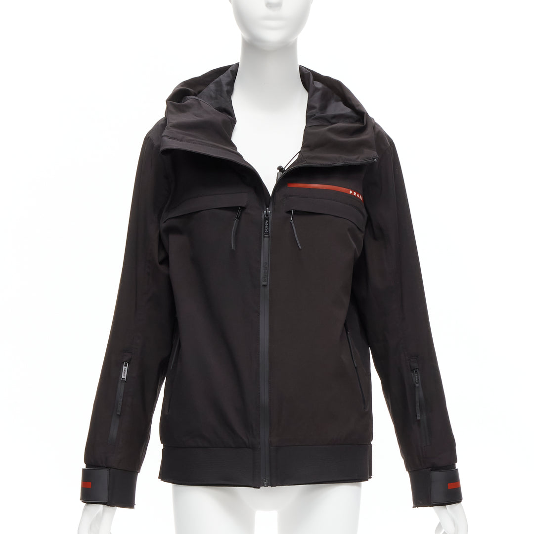 Female mannequin wearing Prada by Miuccia Prada 2021 Linea Rossa Black Nylon Women Parka Jacket in Size  M | Available at JHROP