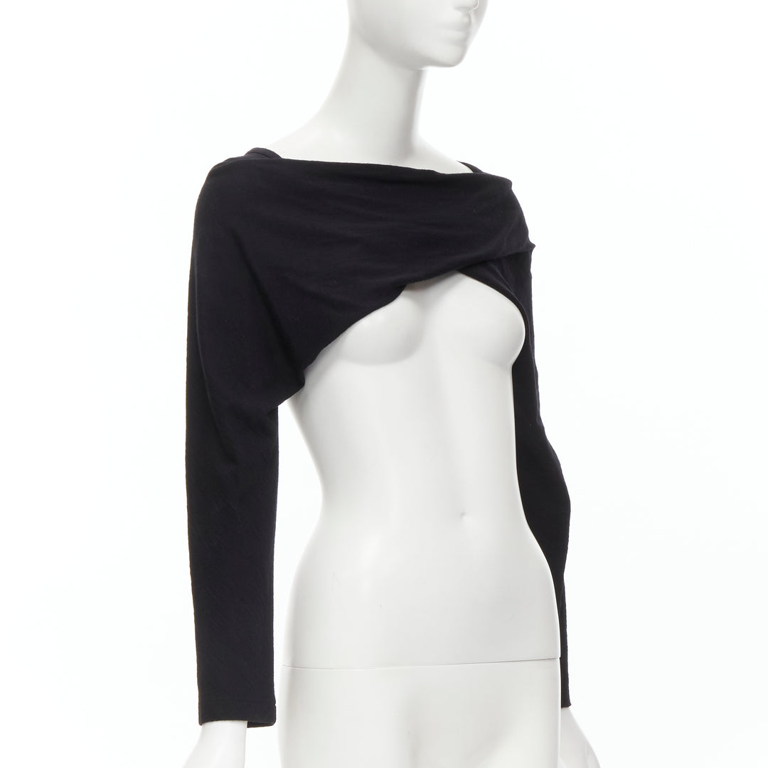 Female mannequin wearing Comme Des Garcons by Rei Kawakubo Black Women Top in Size  S | Available at JHROP